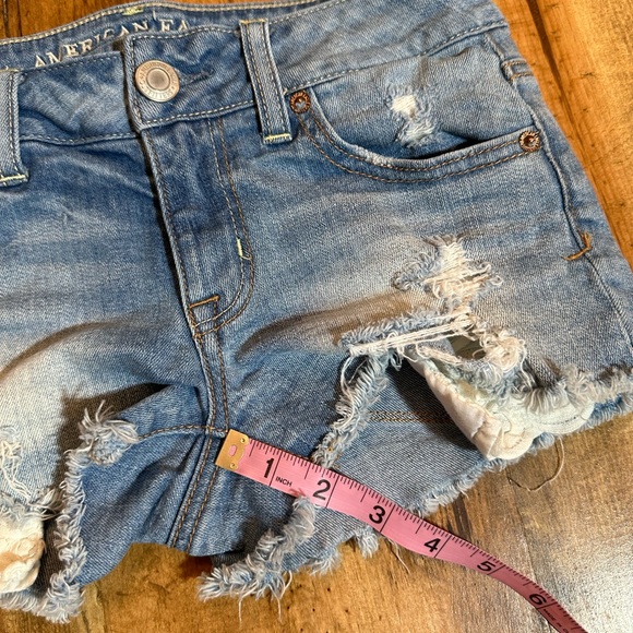 Women’s American Eagle Shortie Denim Shorts. Eyelet distressed. Size 0 - Picture 6 of 6